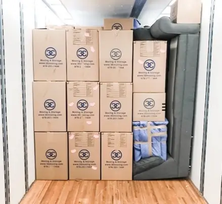 Boxes stacked securely in the back of a moving truck